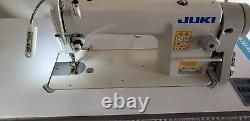 Juki DDL-8700 SEWING MACHINE WITH T-LEGS STAND, CASTERS, SERVO MOTOR LED LAMP