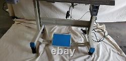 Juki DDL-8700 SEWING MACHINE WITH T-LEGS STAND, CASTERS, SERVO MOTOR LED LAMP