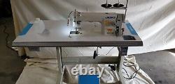 Juki DDL-8700 SEWING MACHINE WITH T-LEGS STAND, CASTERS, SERVO MOTOR LED LAMP