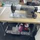 Used Juki industrial sewing machines for sale with table and lamp