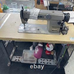 Used Juki industrial sewing machines for sale with table and lamp