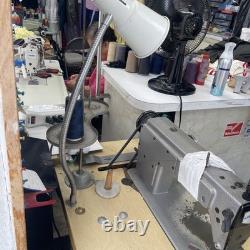 Used Juki industrial sewing machines for sale with table and lamp